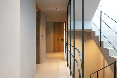 a hallway of a house with stairs and a door at Souda Plaza Collection in Souda