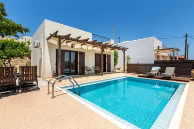 a swimming pool in front of a villa at Villa Henry Darmarohori in Darmarochori