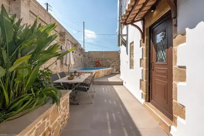 an internal courtyard of a house with a pool at Pool Villa Michail, in Kissamos! in Koukounará