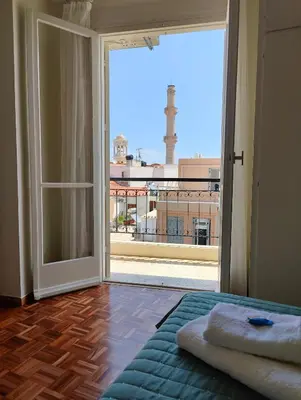 a room with an open door with a view of a city at Chania-Limani Splantzia-geada in Chania Town