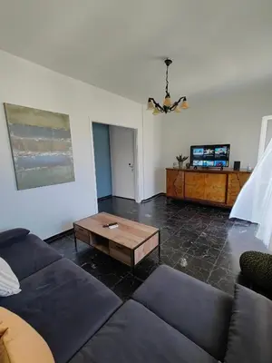 a living room with a couch and a coffee table at Chania-Limani Splantzia-geada in Chania Town