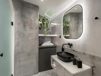 a bathroom with a black sink and a mirror at Malmáki, a street view apartment in Chania Town