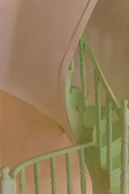 a stairway with a green railing and a stair case at History & Culture in Old Town Chania in Chania Town