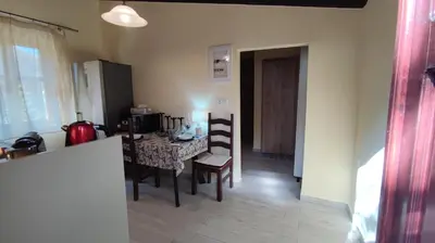 a kitchen and dining room with a table and chairs at Dominic Central Venetian Castle Old Port Apartment in Chania Town