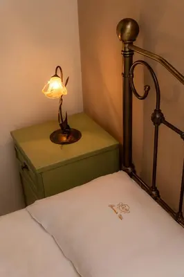 a bedroom with a bed with a lamp on a night stand at Giovanta Villa in Kondomari