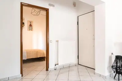 a hallway with a door leading to a bedroom at Peggy's apartment in Chania in Chania Town