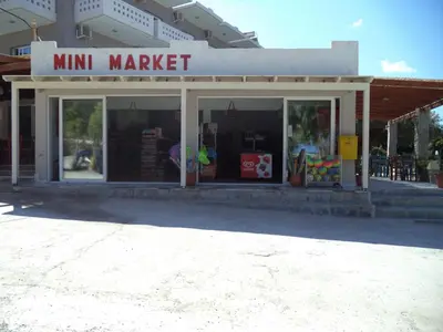 a mini market in front of a building at Falasarna Bay in Falasarna