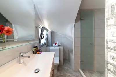 a bathroom with a sink and a toilet at Sunshine Suite Junior in Chania Town