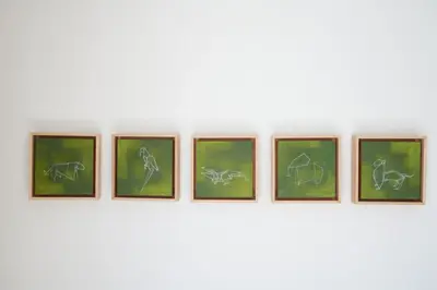 a group of four framed drawings of animals on a wall at KaiZen Chania - New Central Apartment Just 350m Away With Private Jacuzzi and free parking! in Chania Town
