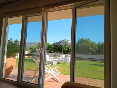 a screened in porch with sliding glass doors at Eos Studio in Chania Town