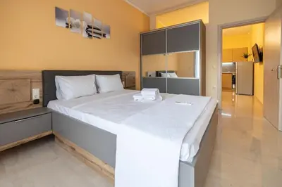 a bedroom with a large white bed in a room at Eleni's apartment in the center of Chania in Chania Town