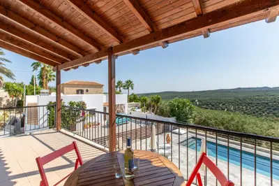 a view from the balcony of a villa with a swimming pool at Villa Daya in Darmarochori