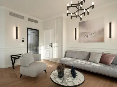 a living room with a couch and a chair at Riviera Suites in Chania Town