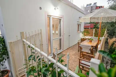 a balcony of a house with a table and chairs at Popi's House in Chania Town