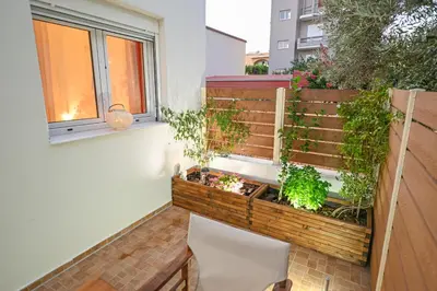 a balcony with plants on the side of a building at Popi's House in Chania Town