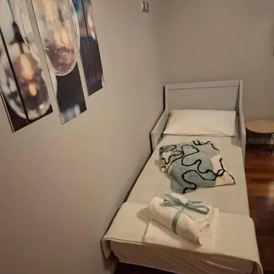 a bed with two towels on it with at Art and view-studio in Kounoupidhianá
