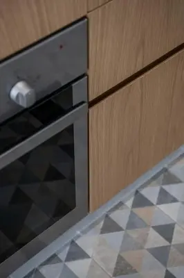 a kitchen with an oven and a tile floor at West City Suite in Chania Town