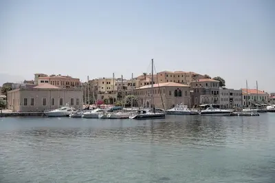 a group of boats docked in a harbor with buildings at West City Suite in Chania Town