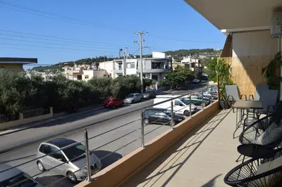 a parking lot with cars parked on the side of a street at Zoe's Luxury Home - Private Parking in Chania Town
