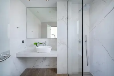 a white bathroom with a sink and a shower at Avra & Ostria Villa, Pirgos-Villas,Heated pool , amazing sea view in Maleme