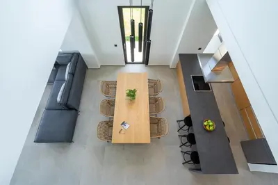 an overhead view of a living room with a table and chairs at Avra & Ostria Villa, Pirgos-Villas,Heated pool , amazing sea view in Maleme