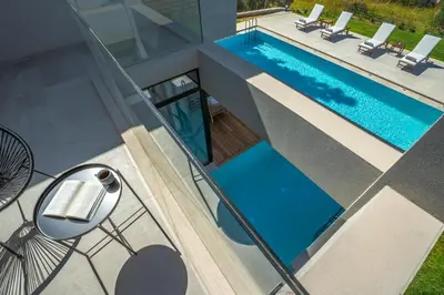 an overhead view of a swimming pool in a house at Avra & Ostria Villa, Pirgos-Villas,Heated pool , amazing sea view in Maleme
