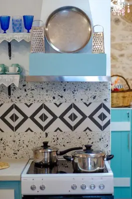 two pots on a stove in a kitchen at Trigono Traditional House in Kalivianí