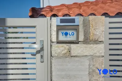 a pay box on the side of a building at Villa YOLO in Almirida