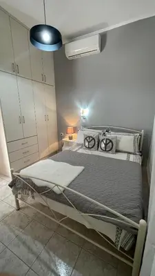 a bedroom with a bed in a room at Gesthimani's Residence in Áyios Yeóryios