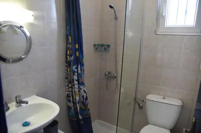 a bathroom with a shower and a toilet and a sink at Relaxing and Comfortable Studio Near Falasarna Beaches in Plátanos