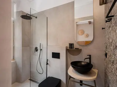 a bathroom with a sink and a shower at Casa Modiano Boutique in Chania Town