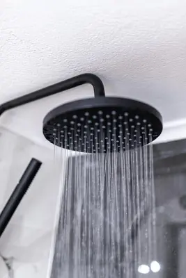 a shower with water hanging from the ceiling at Nostos Central Apartment in Chania Town