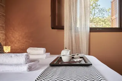 a hotel room with a bed with a tray of towels at Sunaktis luxury villa in Chania Town