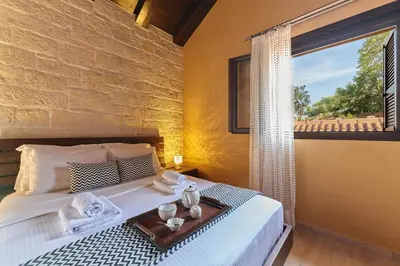 a bedroom with a bed with a tray on it at Sunaktis luxury villa in Chania Town