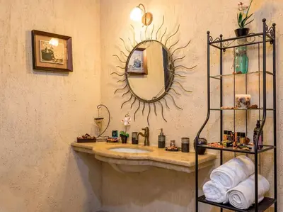 a bathroom with a sink and a mirror on the wall at Villa Malaxa Private Luxury with Amazing View in Maláxa