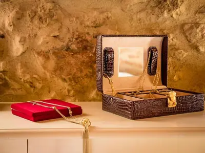 a basket with a mirror and a red box on a counter at Villa Malaxa Private Luxury with Amazing View in Maláxa
