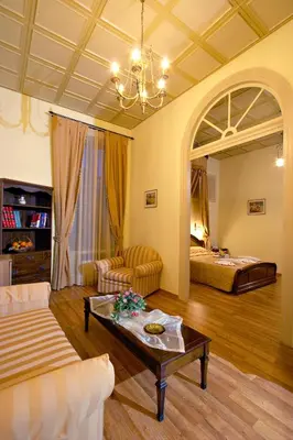 a living room with a couch and a table at Halepa Hotel in Chania Town