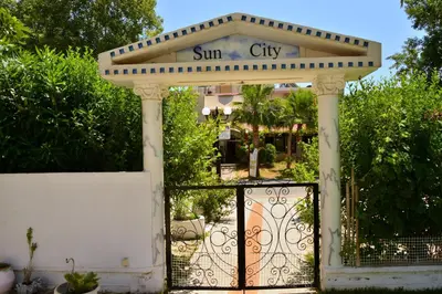 a gate with a sun city sign on it at Sun City in Kato Daratso