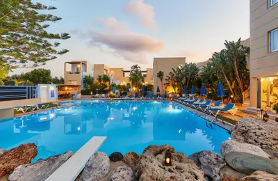 a large pool with blue water in a resort at Futura Hotel in Maleme