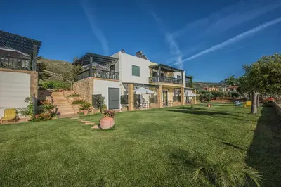 a large house with a large yard with a large yard sidx sidx sidx at Magnolia Apartments and Studios in Falasarna