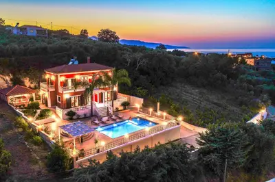 an aerial view of a house with a swimming pool at Iro Royal Villa by PosarelliVillas in Dhémbla