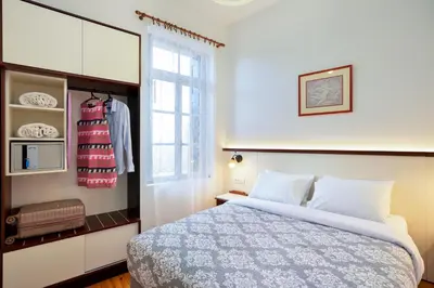 a bedroom with a bed and a window at Silde Studios & Apartments in Chania Town