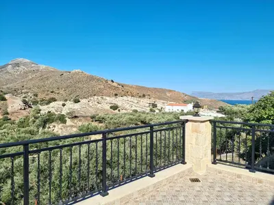 a balcony with a view of the mountains at Enastron vacation house in Kissamos