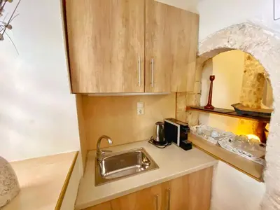 a small kitchen with a sink and a microwave at Boutique Hotel Del Doge in Chania Town