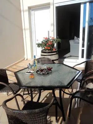 a black table and chairs in a room at The Getaway in Agia Marina Nea Kydonias