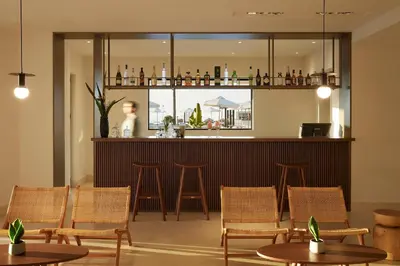 a bar in a restaurant with chairs and tables at Asterion Suites & Spa - Designed for Adults in Gerani Chanion