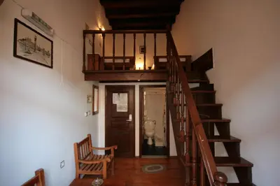 a wooden staircase in a room with a stair case at Chania Rooms in Chania Town