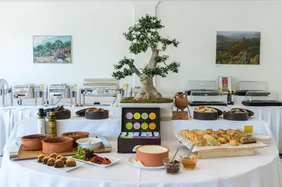a table with various food items on it at Kydon The Heart City Hotel in Chania Town