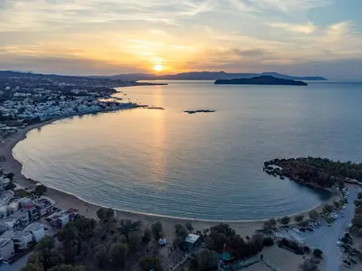an aerial view of a beach at sunset at Villa Meltemi in Daratso