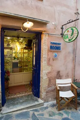 a store with a sign that reads timinated rooms at Pension Eva in Chania Town